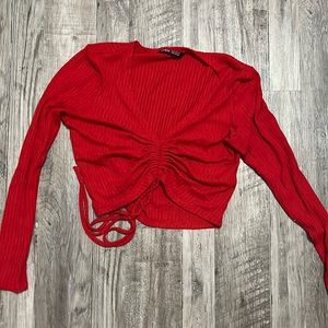Long sleeve crop top from SHEIN it is red and it is tied in the front